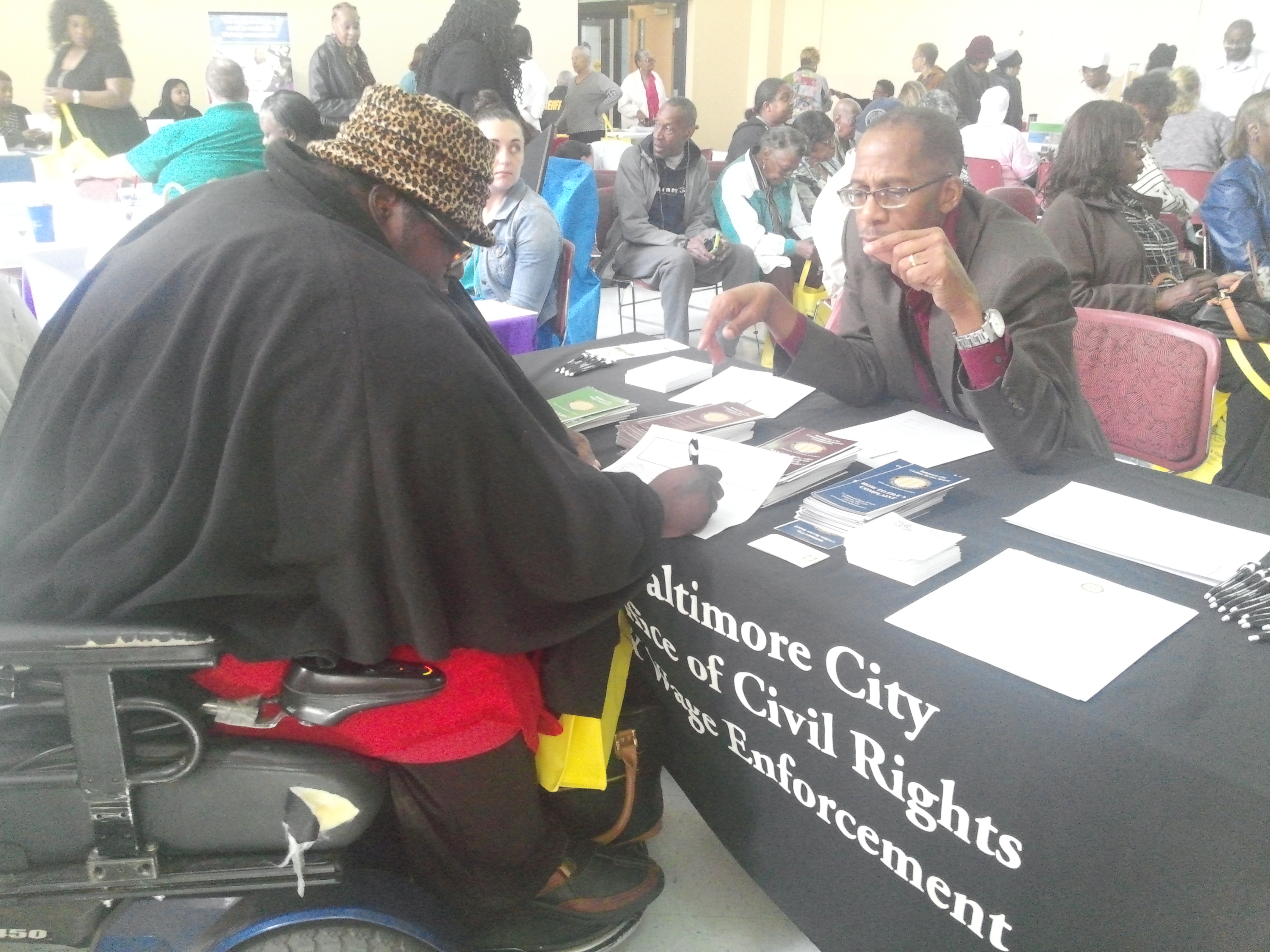 Anthony Jemison speaking to a Community Member